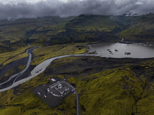 Lake, mountains, car park, car, mass tourism, overtourism, cloudy, rainy, summer, aerial view, Myrdalsjökull, Iceland