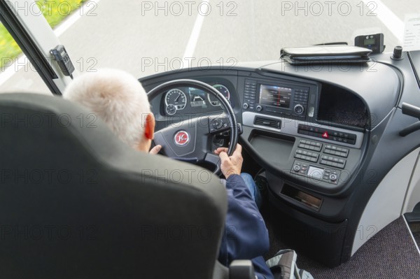 A driver steers a vehicle on the motorway, view of the steering wheel, Lake Constance, Germany