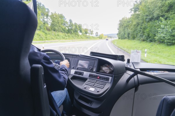 Interior view of a vehicle driving on a motorway through a green landscape, Lake Constance, Germany