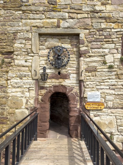 View over fortified bridge to historic small narrow castle gate Access to castle courtyard of 13th century Trendelburg Castle, today Burghotel Trendelburg, Trendelburg, Weserbergland, Hesse, Germany