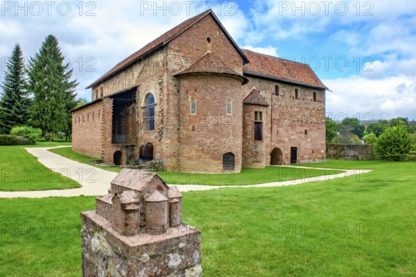 View of the three-nave Einhard basilica of St Marcellinus and St Peter, built in the Middle Ages from 824, church building in Carolingian architecture, in the foreground model of the original building of the Einhard basilica made of stone, Steinach, Michelstadt, Hesse, Germany