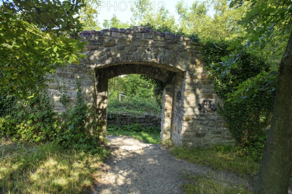 View from the former castle courtyard to the former castle gate entrance to the historic curtain wall of today's Isenburg castle ruins, Schellenberger Wald, Essen, North Rhine-Westphalia, Germany