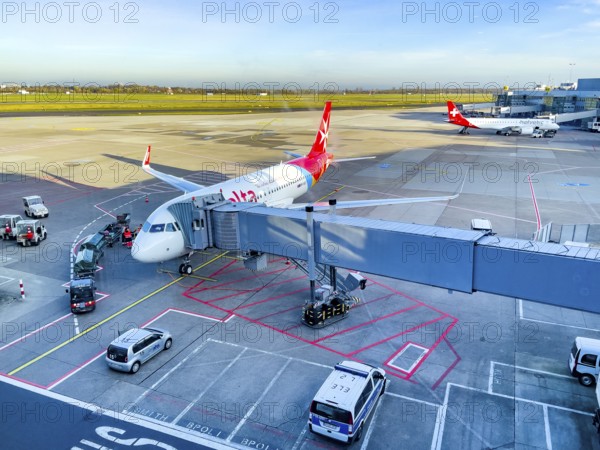View of passenger aircraft of Air Malta at finger bridge for boarding disembarking passengers in front of airport building, in the background apron of Düsseldorf International Airport DUS, Düsseldorf, North Rhine-Westphalia, Germany
