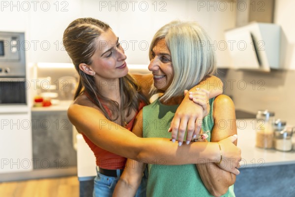 Daughter embracing her elderly mother in a bright kitchen, radiating love and care in a warm, domestic atmosphere filled with happiness