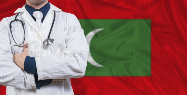 Male doctor with stethoscope on Maldivian flag. Doctor holding stethoscope on Maldives flag