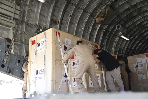 Members of the Qatari Air Force unload humanitarian aid supplies from a transport aircraft at Damascus International Airport as part of Qatar's air and land relief bridge to Syria, Damascus, Damascus, Syria