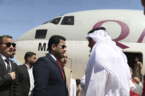 Syrian Health Minister Musab al-Omar welcomes a Qatari aircraft loaded with medical and humanitarian supplies at Damascus International Airport, part of Qatar's major aid to support Syria's recovery after the, Damascus, Damascus, Syria