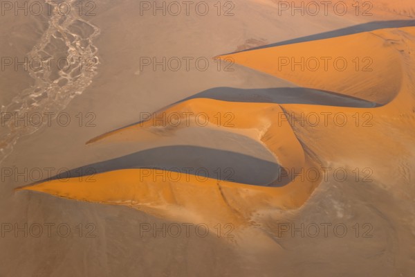 Sand dunes in the Namib Desert. In the evening. Aerial view. Namib-Naukluft Park, Namibia