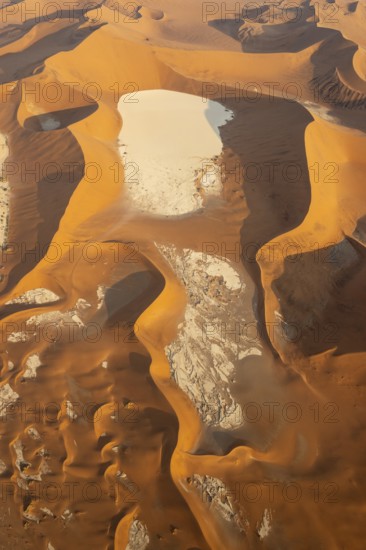 Aerial view of the Dead Vlei, a dry pan in the centre of the Namib Desert, and the surrounding sand dunes. In the evening. Namib-Naukluft Park, Namibia