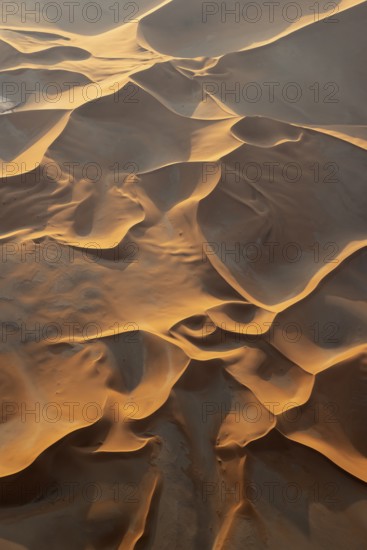 Sand dunes in the Namib Desert. In the evening. Aerial view. Namib-Naukluft Park, Namibia