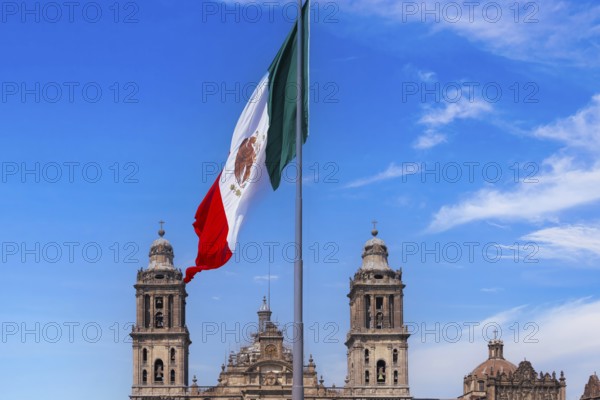Mexican flag in Zocalo Constitution Square. Mexico city, Metropolitan Cathedral and National Palace