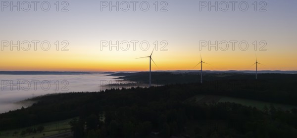 Several wind turbines above a foggy landscape at sunrise, near Schorndorf, Rems-Murr district, Rems-Murr-Kreis, Baden-Württemberg, Germany