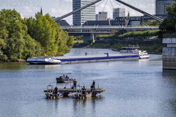Exercise run of a multi-purpose pontoon on the Rhine, Medienhafen, of the Water Hazards Section, in Düsseldorf, the motorised pontoon can be used as a ferry for people or equipment, as a working platform or bridge, during the major exercise FÜLEX25, lasting several days, of the THW, Technisches Hilfswerk, Landesverband North Rhine-Westphalia, on 4 weekends over 3500 volunteers from the 127 North Rhine-Westphalia local associations practise many different deployment scenarios