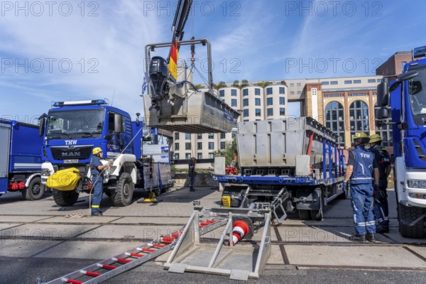 Launching, with crane, of a THW multi-purpose boat in front of a training trip on the Rhine, near Düsseldorf, of the Water Hazards Section, this type of boat is used to transport people and goods as a rescue boat and as a working platform, during the major exercise FÜLEX25, lasting several days, of the THW, Technical Relief Organisation, North Rhine-Westphalia Regional Association, over 3500 volunteers from the 127 North Rhine-Westphalia local associations practise many different deployment scenarios over 4 weekends
