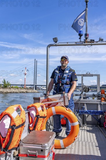 Multi-purpose boat of the THW during a training trip on the Rhine, Medienhafen in Düsseldorf, of the specialist group for water hazards, this type of boat is used to transport people and goods as a rescue boat and as a working platform, during the major exercise FÜLEX25, lasting several days, of the THW, Technisches Hilfswerk, Landesverband North Rhine-Westphalia, on 4 weekends over 3500 volunteers from the 127 North Rhine-Westphalia local associations practise many different deployment scenarios