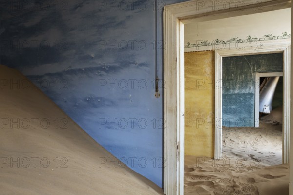 At Kolmanskop, the abandoned ghost town of the diamond days of the early 1900 and of German origin. Inside the restricted Diamond Area east of the coastal town of Lüderitz. Namib Desert, Namibia