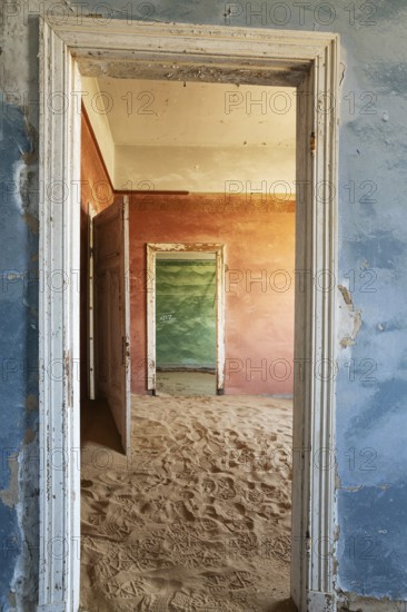 At Kolmanskop, the abandoned ghost town of the diamond days of the early 1900 and of German origin. Inside the restricted Diamond Area east of the coastal town of Lüderitz. Namib Desert, Namibia