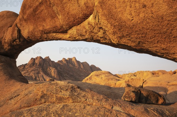 The Pondok mountains seen through The Bridge belong to the Spitzkoppe mountain compound. Damaraland, Namibia