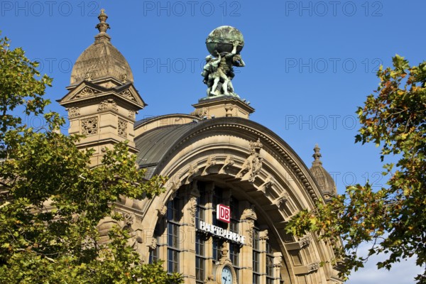 Main front of the main railway station with Atlas carrying the globe on his shoulders, Frankfurt am Main, Hesse, Germany