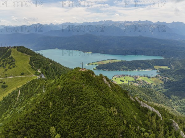 Panorama of a mountain and lake landscape with a summit cross in the foreground, Herzogstand summit, Walchensee, Schlehdorf, Germany
