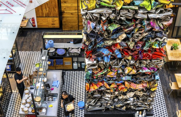 Interior design, artwork made from compressed scrap cars, partially vacant Shopping Quartier 205 in Friedrichstraße and Mohrenstraße, Berlin, Germany