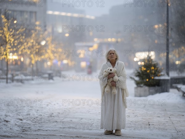 An elderly woman in a nightgown stands with her teddy bear in a cold, wintry environment, looking confused, helpless and disorientated, symbolising dementia, Alzheimer's, AI generated