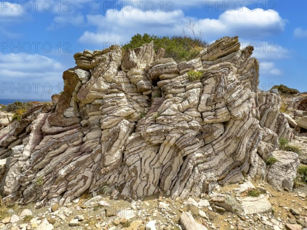 Tourist attraction destination Agios Pavlos Rock with striking folded rock, Agios Pavlos, Crete, Greece
