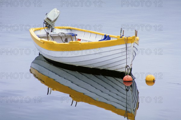 Fishing boat reflected on the lake, England, Great Britain