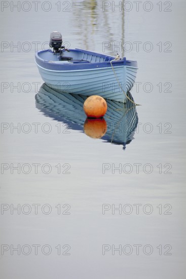 Fishing boat reflected on the lake, England, Great Britain