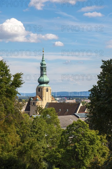 Church tower of St Stephan in Baden in front of a blue sky with clouds, Baden, Lower Austria, Austria