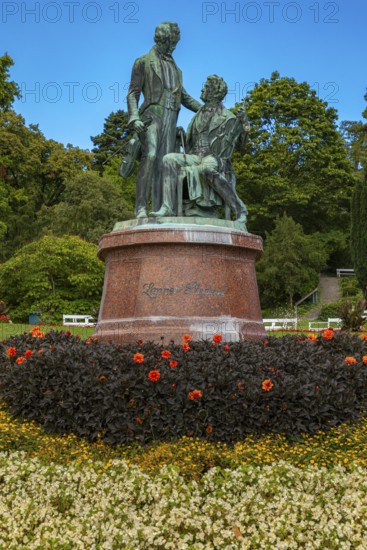 Lanner-Strauss monument surrounded by flowers and trees in the spa garden Baden, Lower Austria, Austria