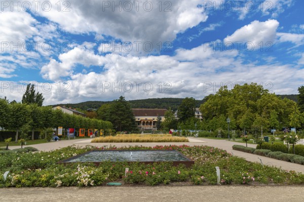 Doblhoffpark with Weikersdorf Castle, flower beds and fountains under a cloudy sky, Baden, Lower Austria, Austria
