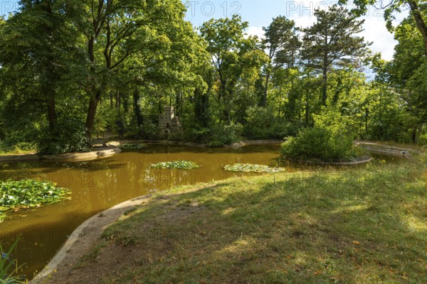 Water lily pond with bee castle in the spa gardens of Baden, Lower Austria, Austria