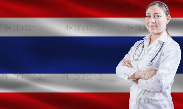 Female doctor on Thailand flag. Doctor with crossed arms on Thailand flag. Thai health and care concept