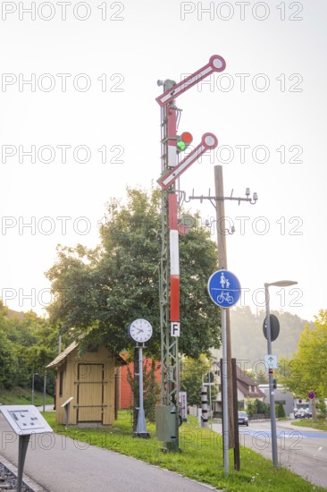 Old railway signal and traffic signs in an urban environment, small town of Perle Nagold, Black Forest, Germany