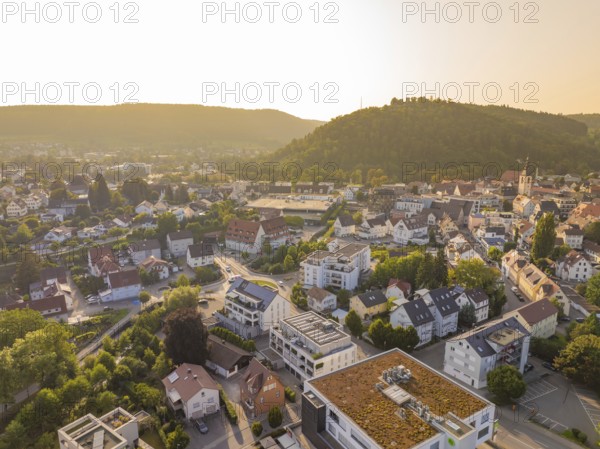 Idyllic town view at sunset with green hills and houses, small town pearl Nagold, Black Forest, Germany