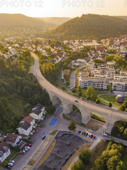 Bird's eye view of the town with viaduct and surrounding hills at sunset, small town Perle Nagold, Black Forest, Germany