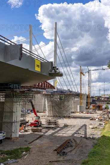 New construction of the second motorway bridge Neuenkamp of the A40, over the Rhine near Duisburg, parallel to the already existing first bridge, most of the new bridge piers are in place, two first bridge segments are finished and have already been moved towards the river on both sides of the Rhine, full completion is planned for 2028, North Rhine-Westphalia, Germany