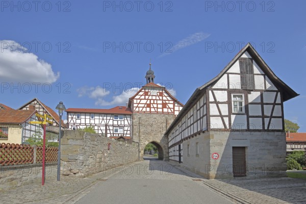 Historic Lower Tor with spire and clock and half-timbered houses, Tor tor, town gate, town wall, Heldburg, Thuringia, Germany