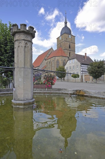 Market fountain and town church of Our Lady built 16th century, water basin, reflection, market, Heldburg, Thuringia, Germany