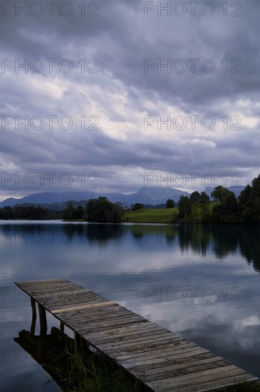 Bathing jetty, jetty, wooden jetty, jetty, leads into a lake, bathing lake, Schwaltenweiher near Seeg, Allgäu Alps, East Allgäu, Allgäu, Swabia, Bavaria, Germany