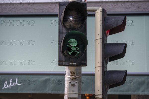 Pumuckel figure in a pedestrian traffic light, Munich, Bavaria, Germany