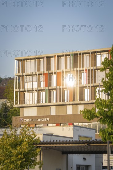Modern office building with glass façade in the sun in an urban environment, Nagold, Calw district, Black Forest, Germany