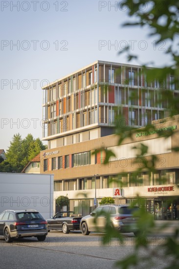 Office building on a street with cars and modern architecture, Nagold, district of Calw, Black Forest, Germany