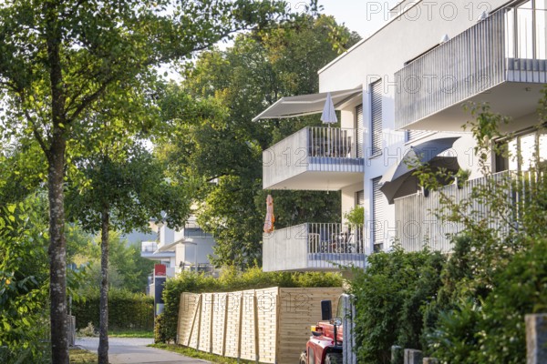 Modern residential building with balconies and trees, sunny summer day, Nagold, district of Calw, Black Forest, Germany