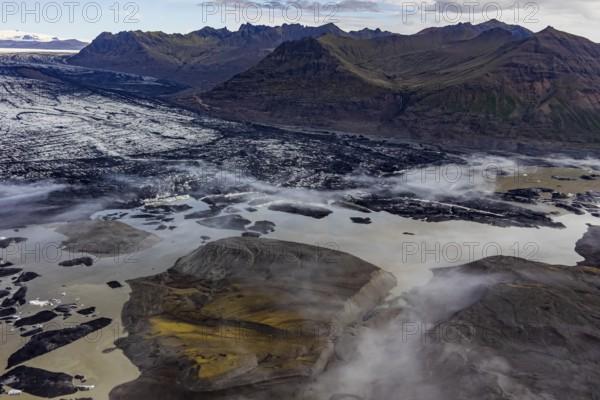 Icebergs, ice floes, glacier tongue, glacier edge, glacier, lake, glacier lagoon, aerial view, black ice, climate change, summer, mountains, Skeidararjökull, Skaftafell, Vatnajökull National Park, Iceland