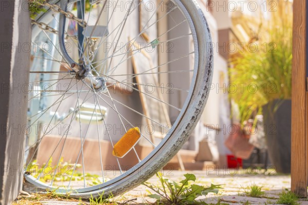 Close-up of a labelled bicycle tyre with green city pavement, small town of Perle Calw, district of Calw, Germany