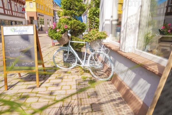 Scenes of a charming street with a pale bicycle and flowers, small town of Perle Calw, district of Calw, Germany