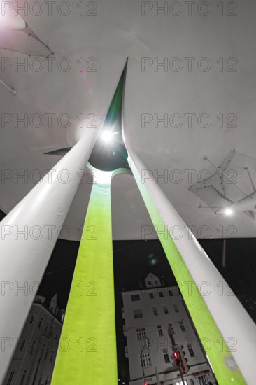 Modern architecture at night with illuminated abstract shapes and acute angles, Munich, Germany