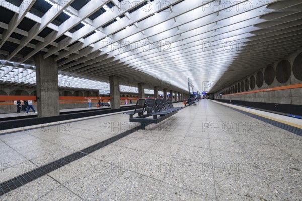 Minimalist railway station with symmetrical design and bright atmosphere, Munich, Germany